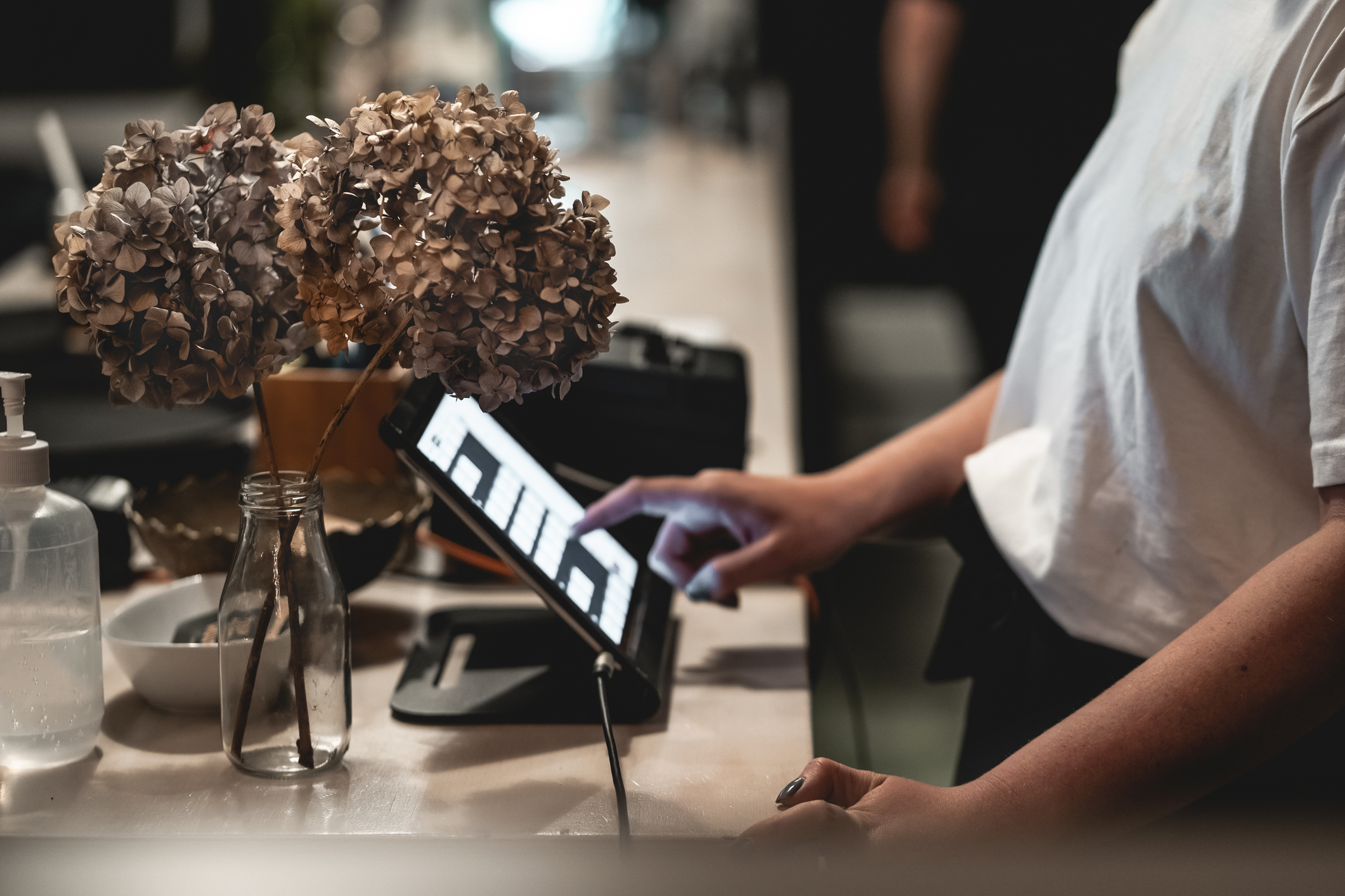 A host working from an iPad at the stand